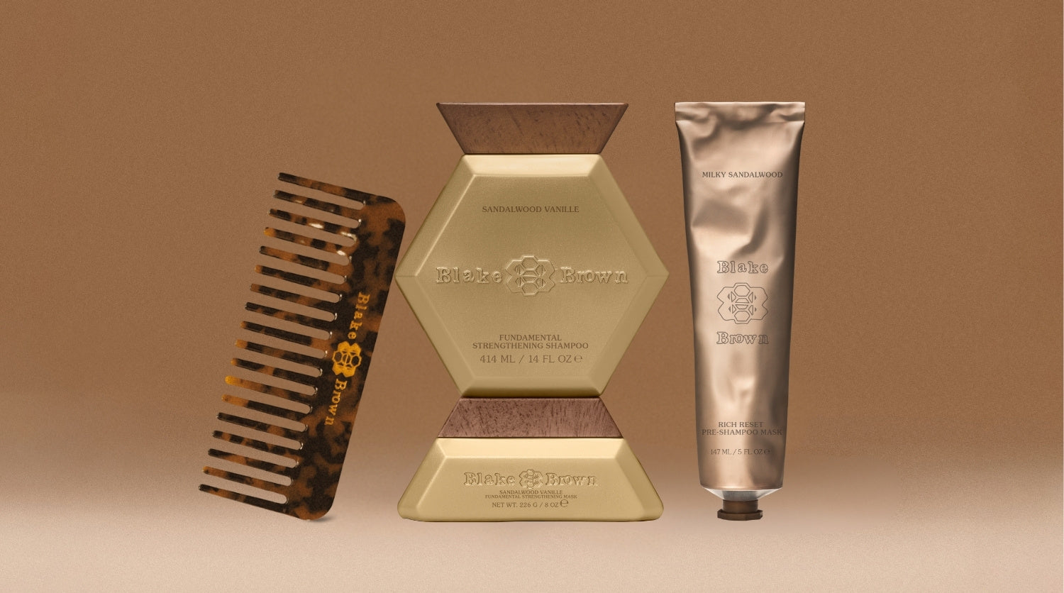 Blake Brown's Strong Hair Essentials for fighting breakage: a branded wide-tooth comb, Pre-Shampoo Mask, and the Strengthening Shampoo and Mask duo.